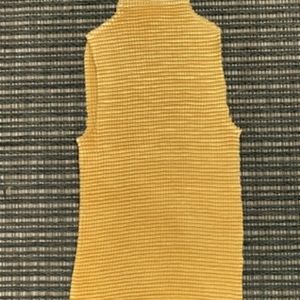 Yellow ruffled mock neck tank top.